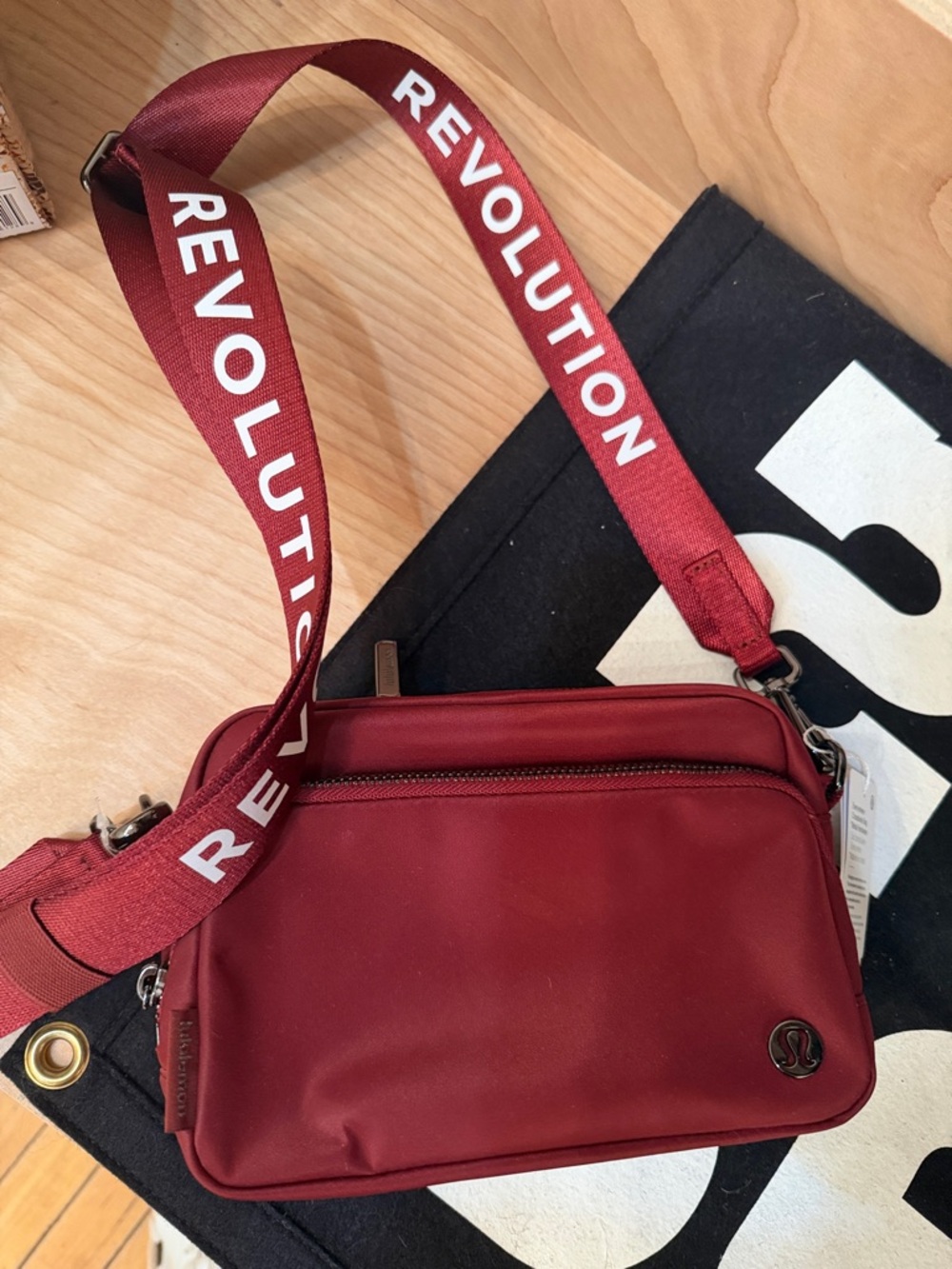 Lululemon Burgundy Crossbody Bag with 'REVOLUTION' Strap NWT
